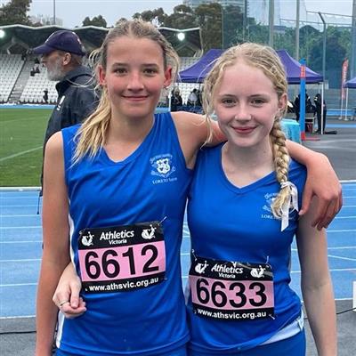 Two Loreto Toorak students posing with their arms around each other